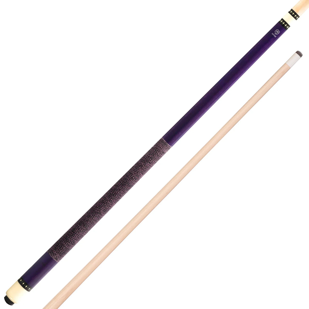 A polished wooden pool cue resting on a dark billiard table with a single billiard ball softly blurred in the background.